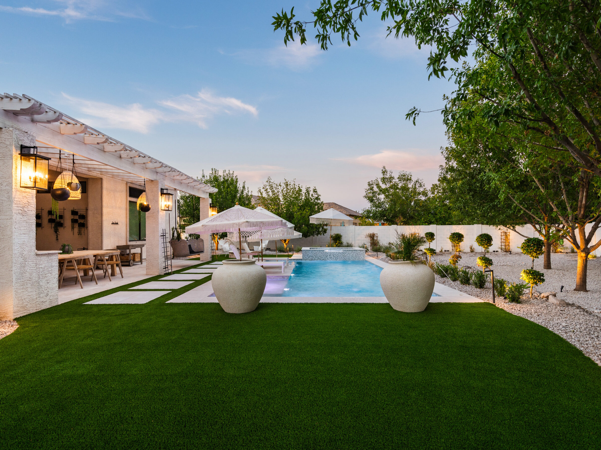 Completed backyard with artificial turf and pavers
